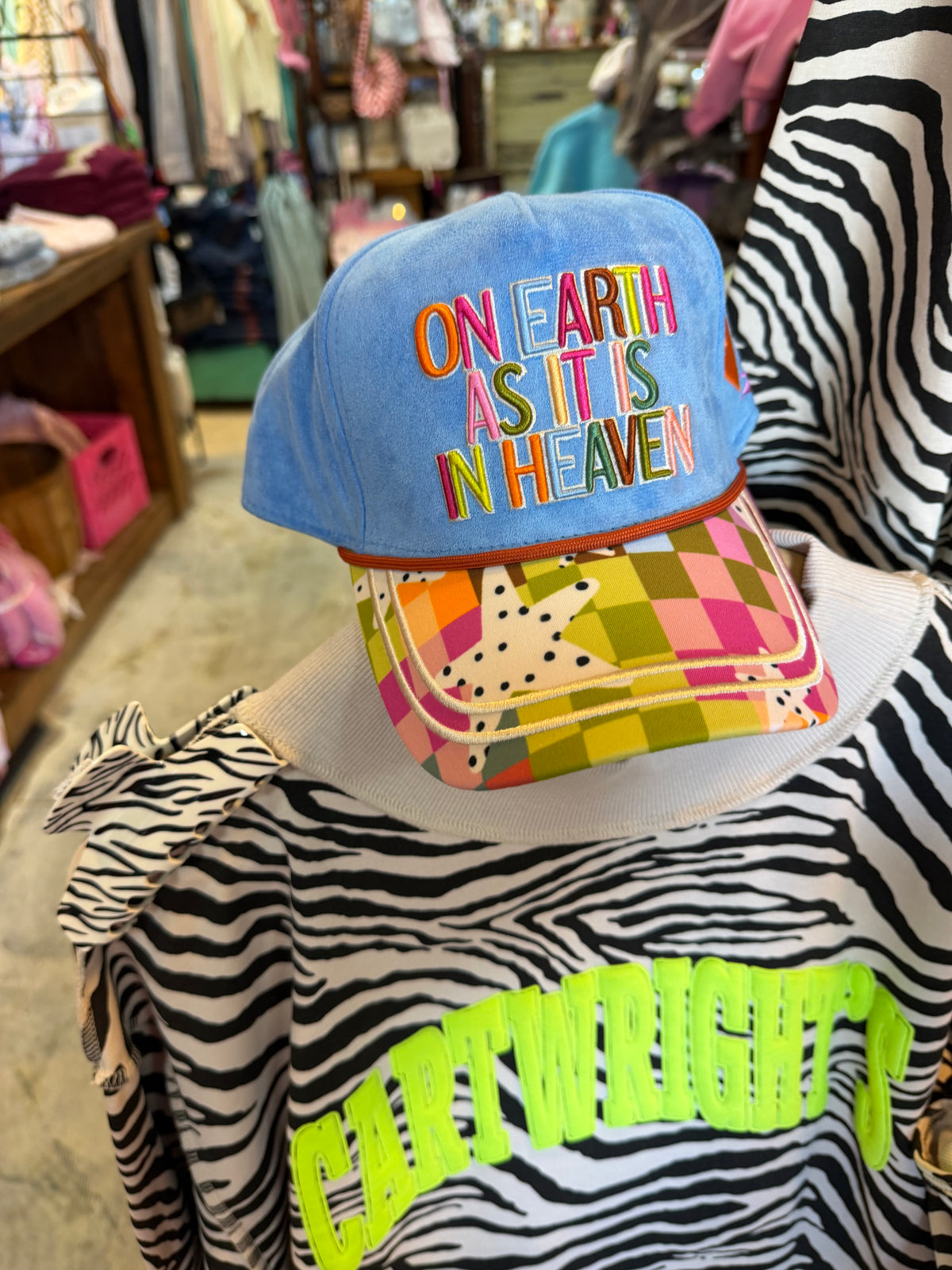 On Earth As It Is Heaven Trucker Hat
